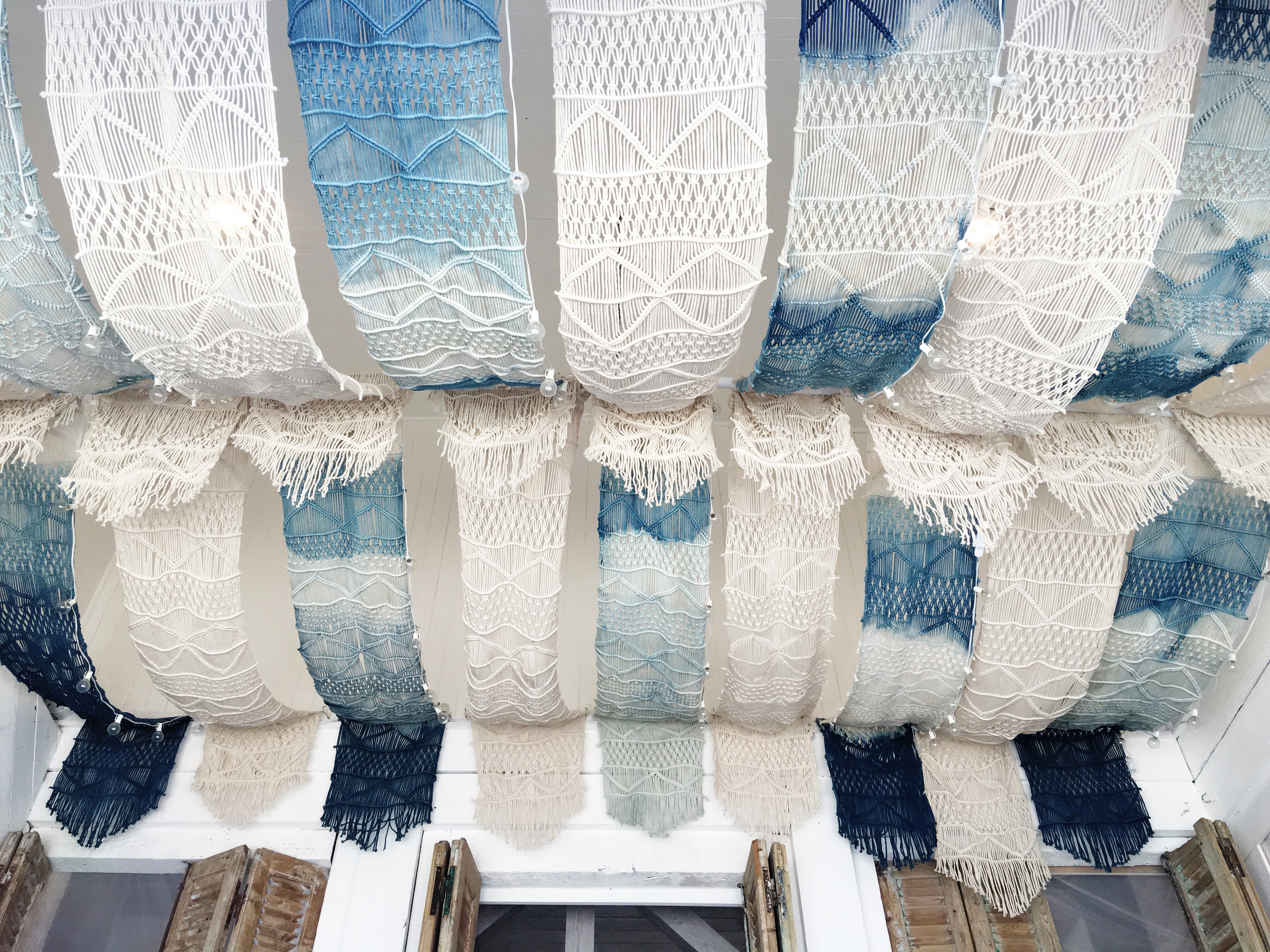 Indigo macrame ceiling at The Butcher's Daughter