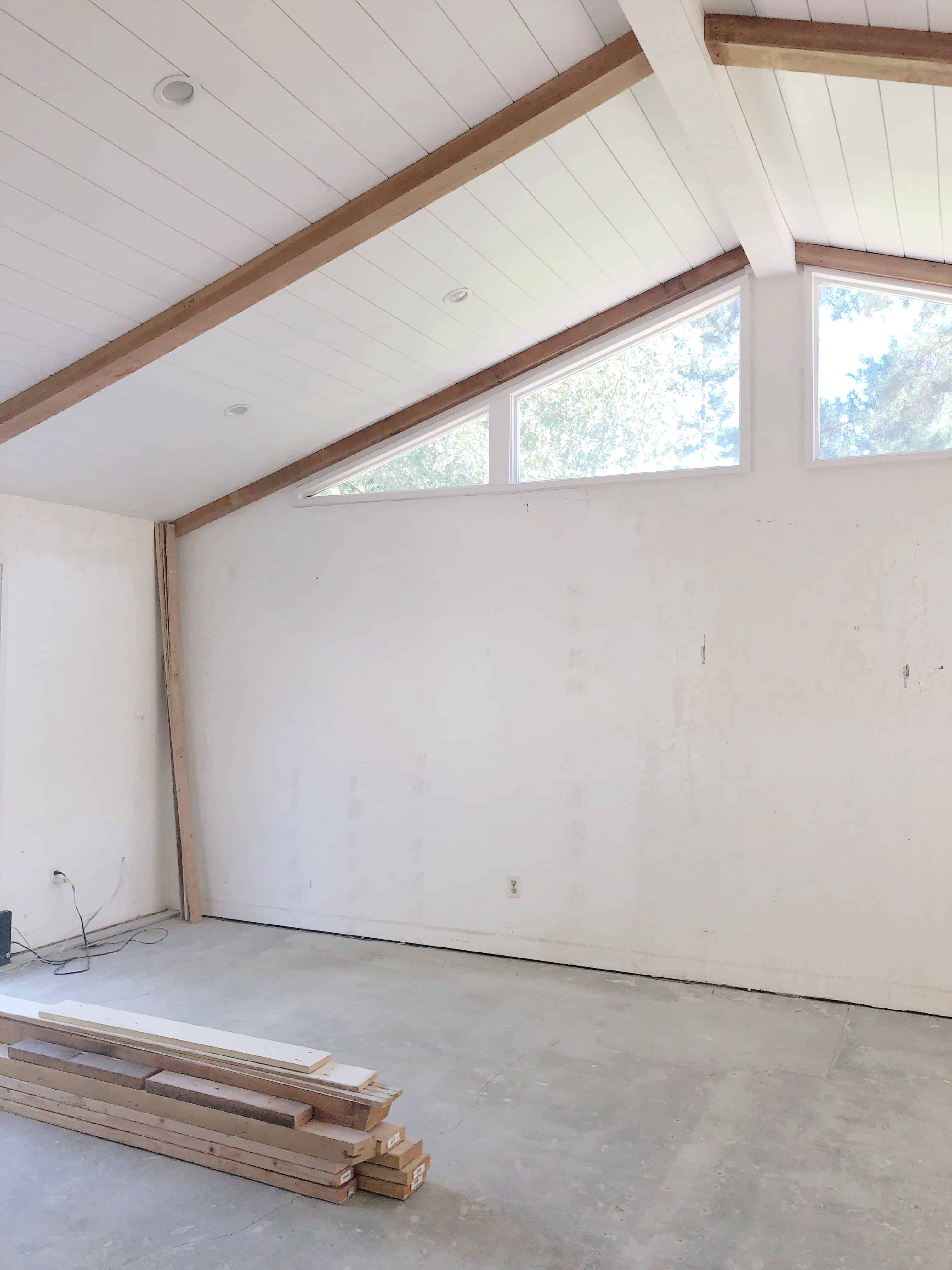 Shiplap paneled ceiling with wood beams